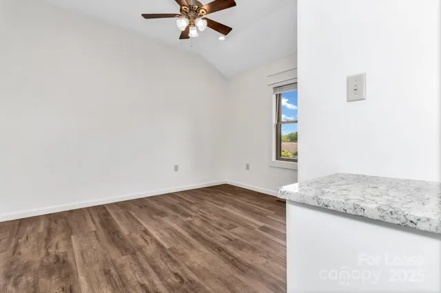 a view of a room with a sink and dishwasher