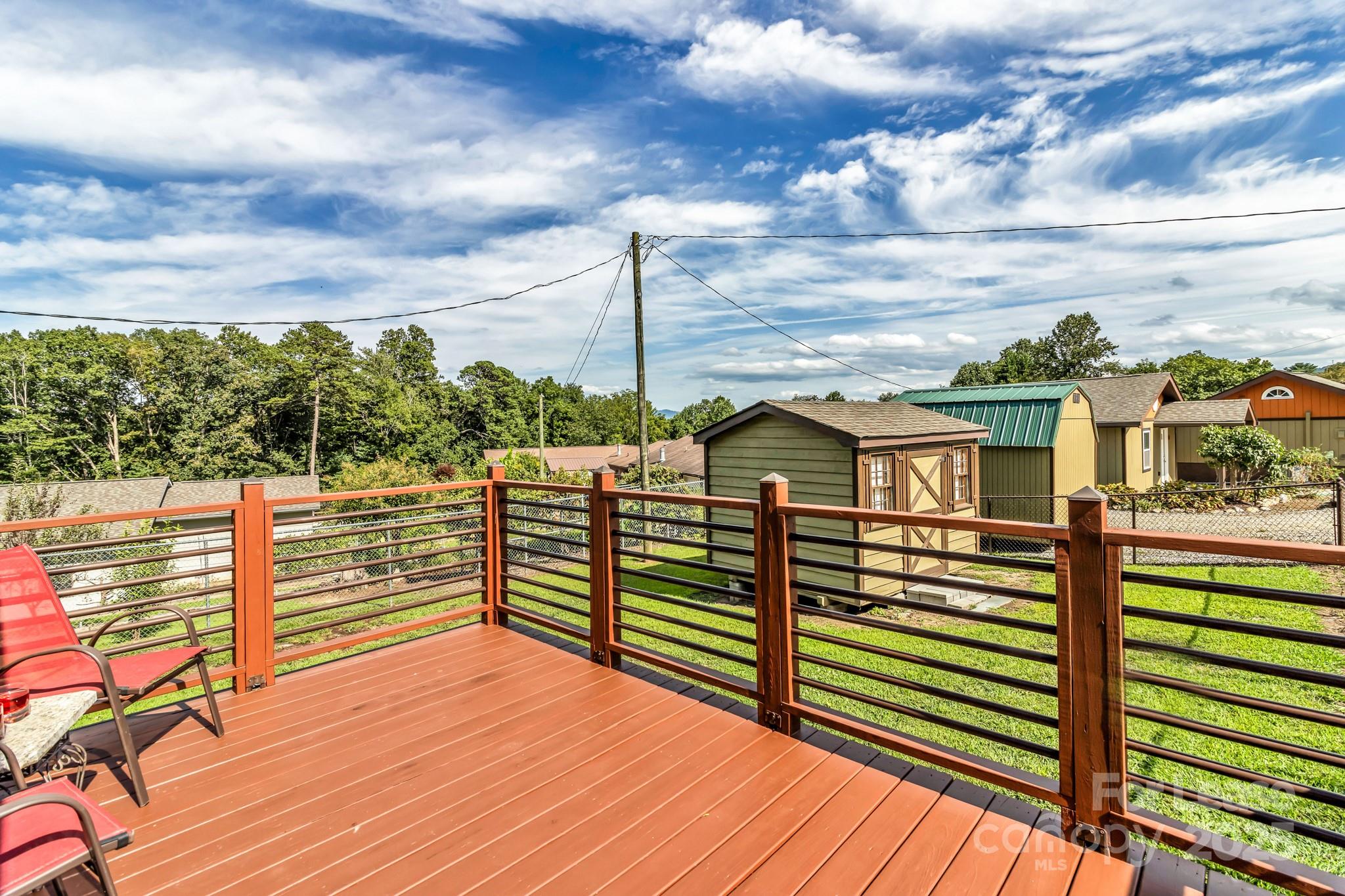 150 Oak Hill Road Candler, NC 28715 - Photo 33 of 44 a view of a balcony with wooden floor and city view