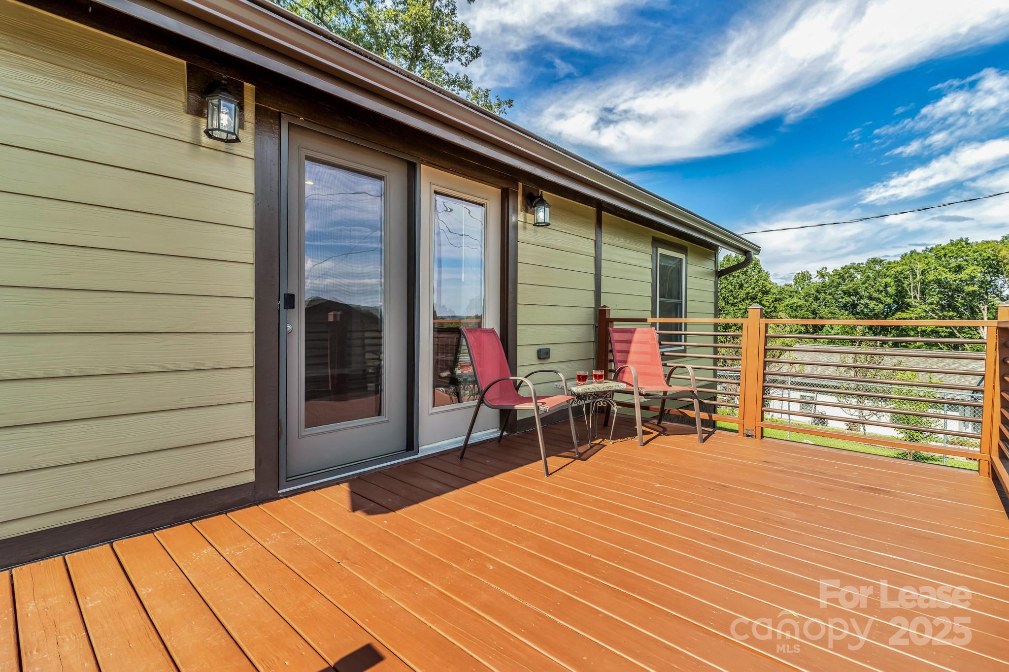 150 Oak Hill Road Candler, NC 28715 - Photo 37 of 44 a balcony with furniture and a potted plant