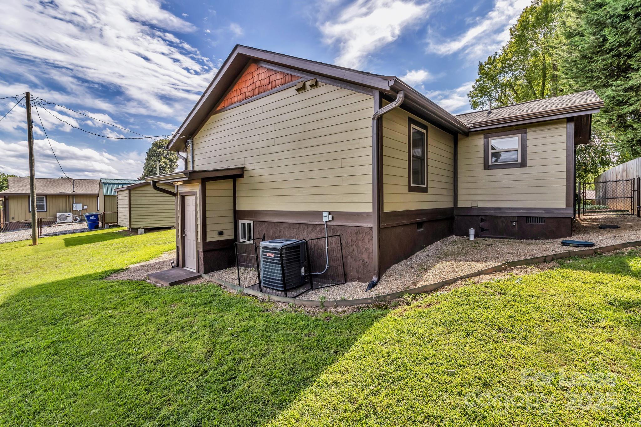 150 Oak Hill Road Candler, NC 28715 - Photo 38 of 44 a view of a house with a yard patio and swimming pool
