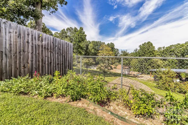a view of a garden with a bench