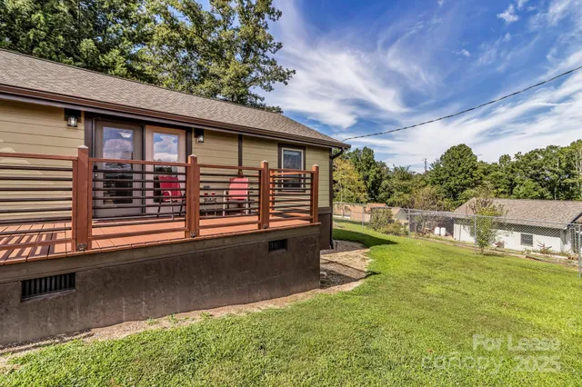 a view of a house with a yard porch and sitting area