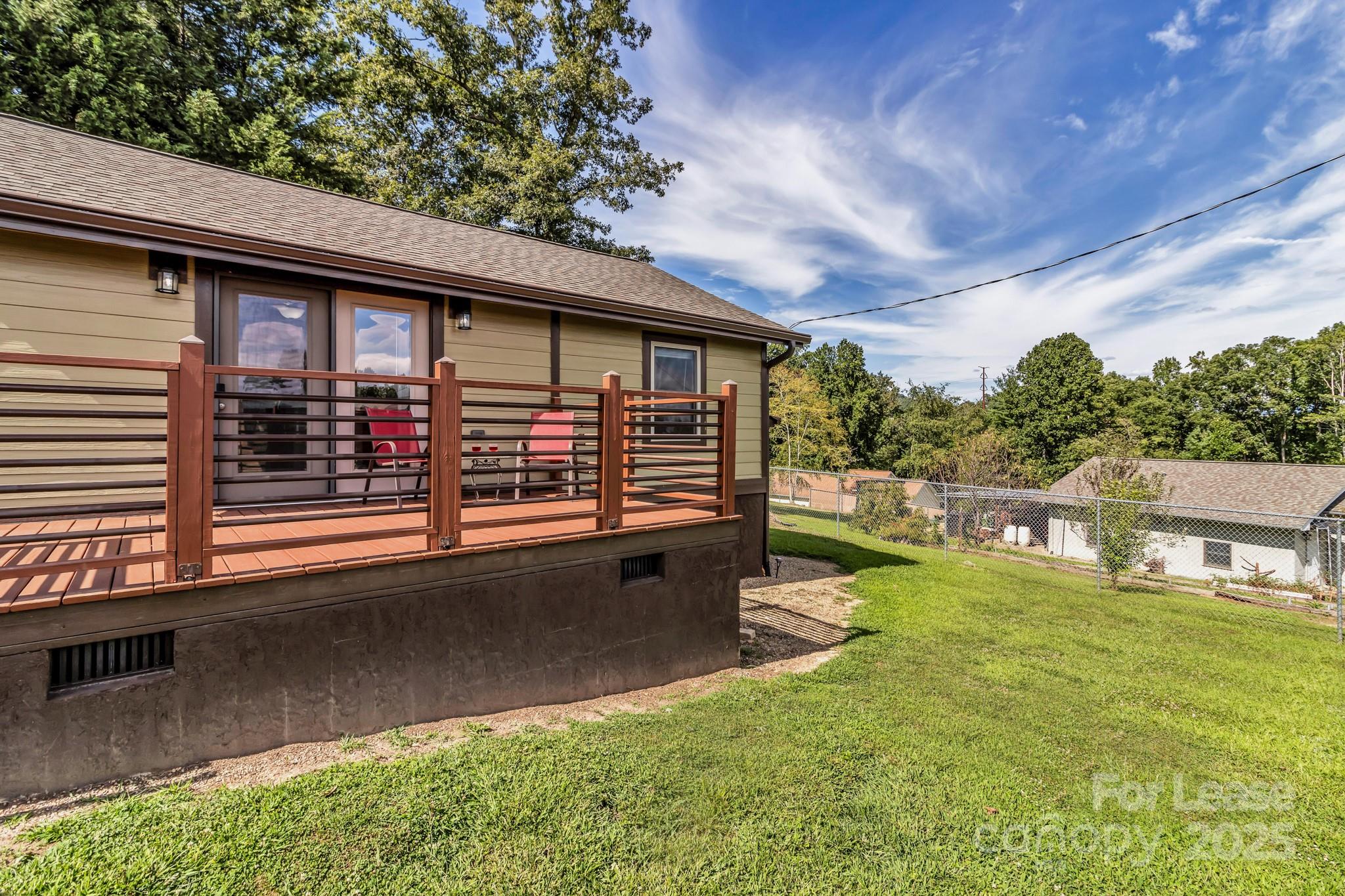 150 Oak Hill Road Candler, NC 28715 - Photo 41 of 44 a view of a house with a yard porch and sitting area