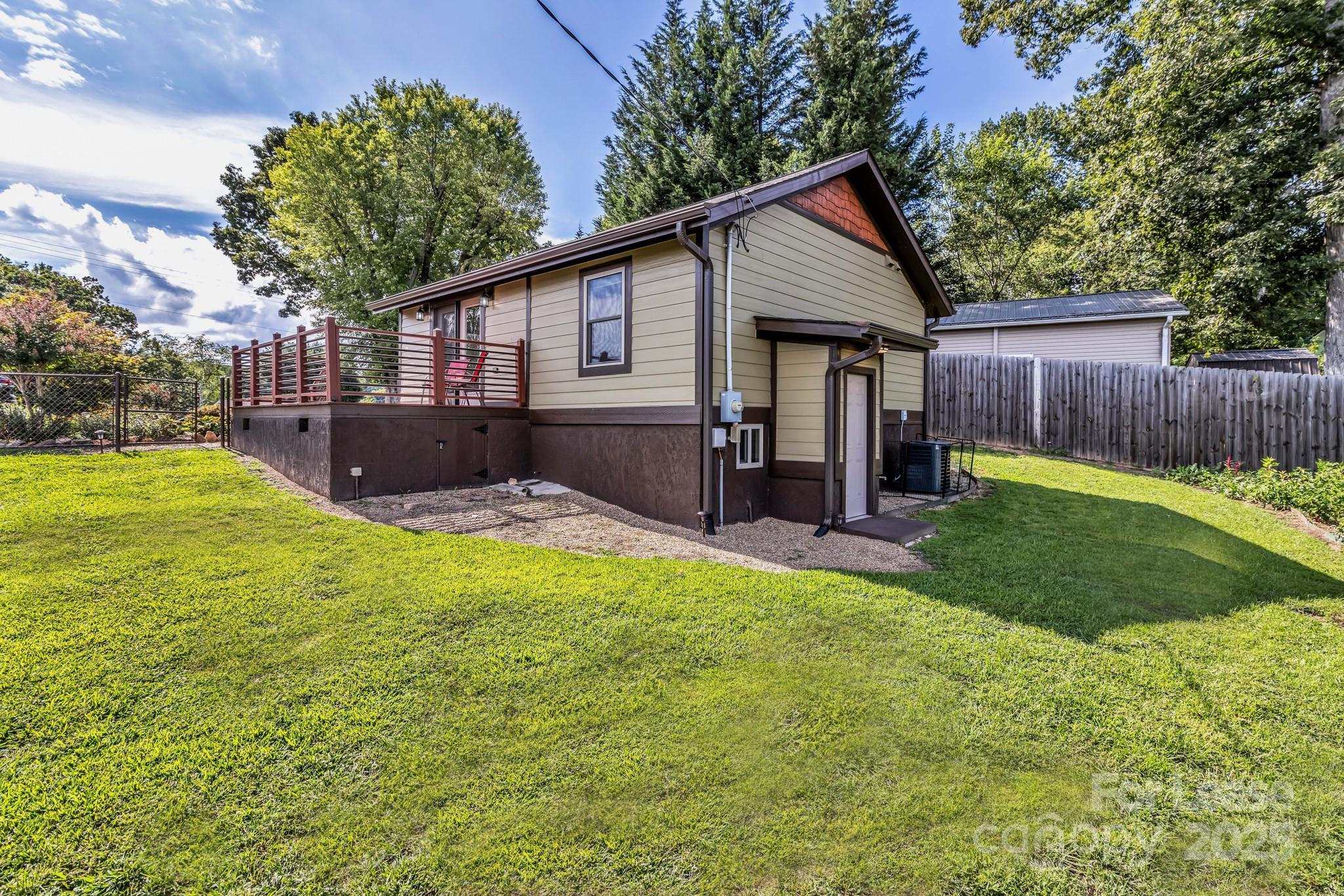 150 Oak Hill Road Candler, NC 28715 - Photo 42 of 44 a view of a house with a yard and furniture