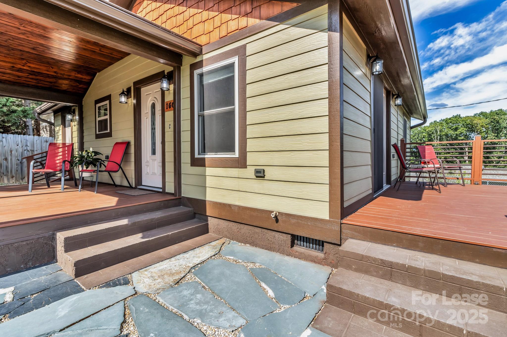 150 Oak Hill Road Candler, NC 28715 - Photo 5 of 44 a view of path along with retail shop and buildings