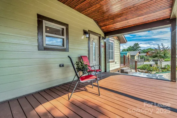 a sitting area with furniture on the deck