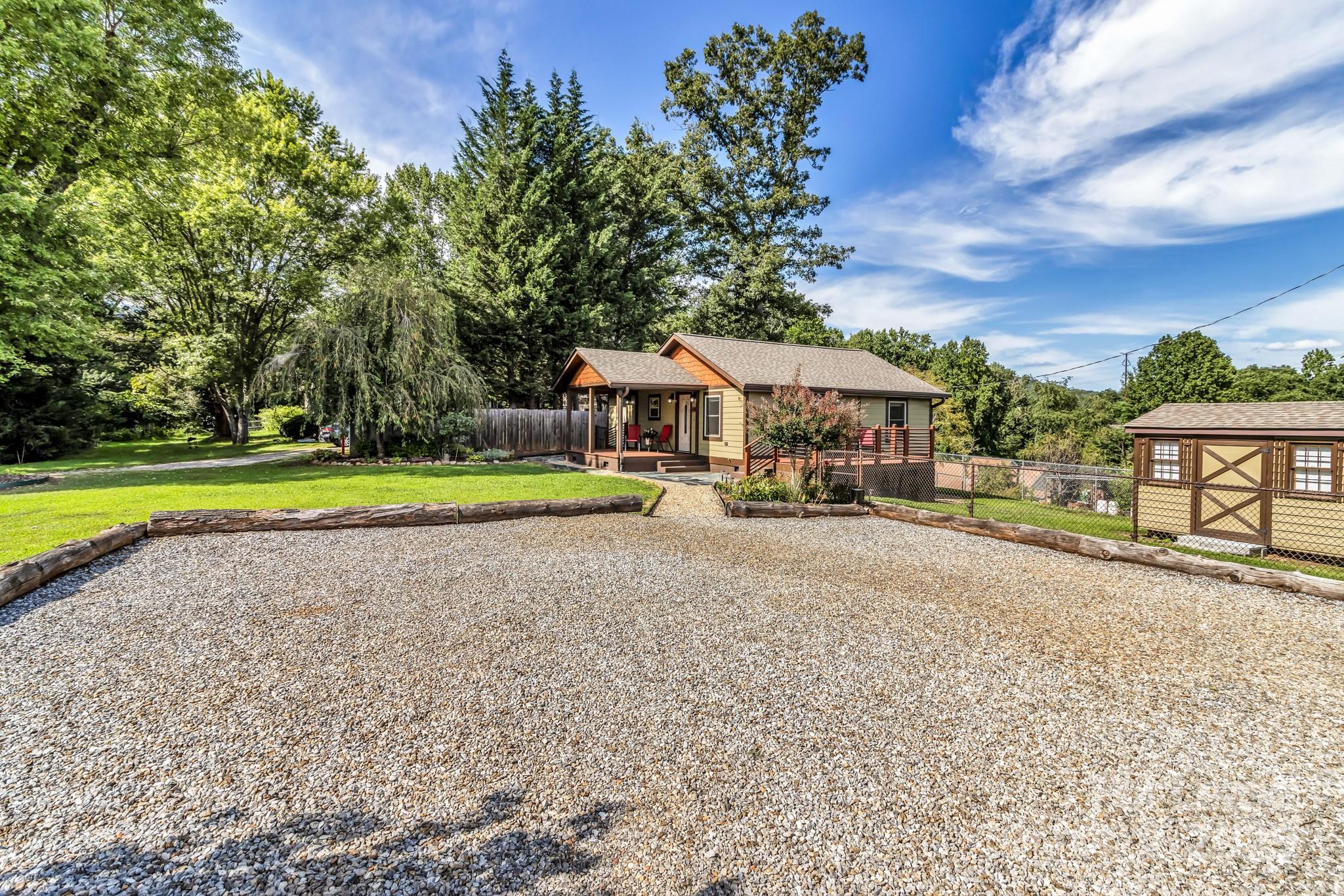 150 Oak Hill Road Candler, NC 28715 - Photo 9 of 44 a house with swimming pool in front of it