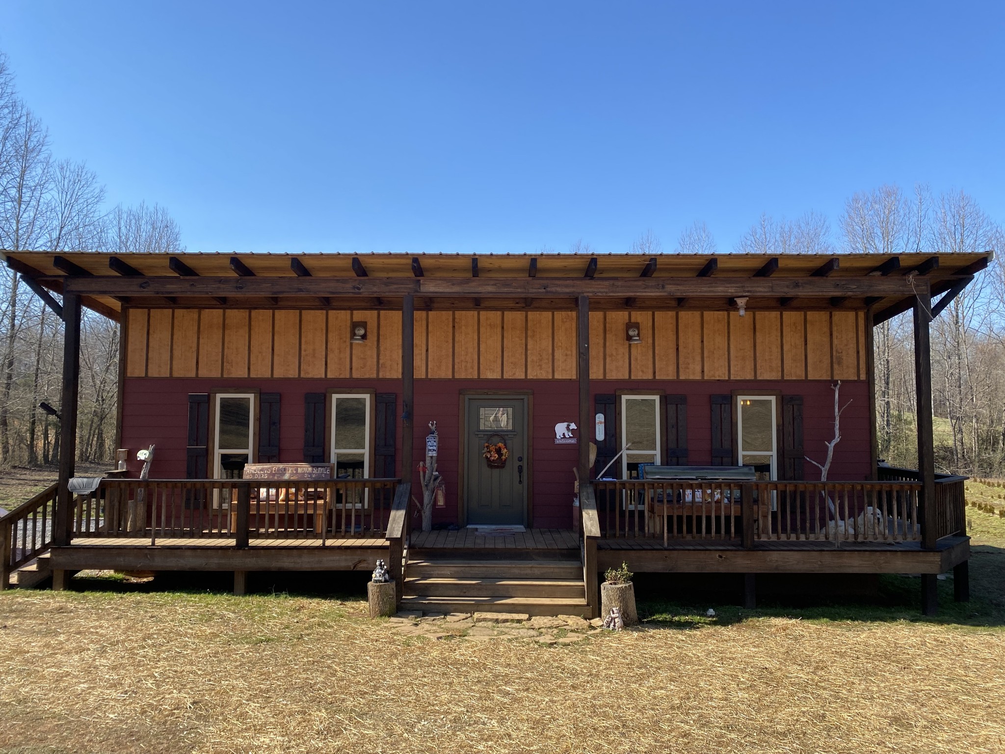 a view of a roof deck with wooden fence and a floor to ceiling window