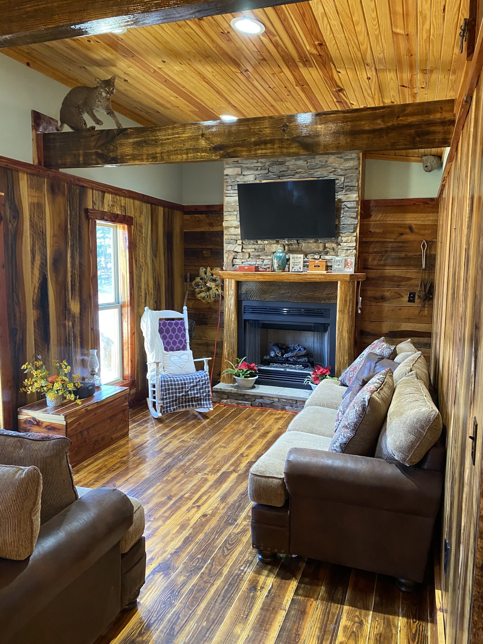 1063 Swan Mill Road Morrison, TN 37357 - Photo 11 of 35 a living room with furniture a flat screen tv and a fireplace