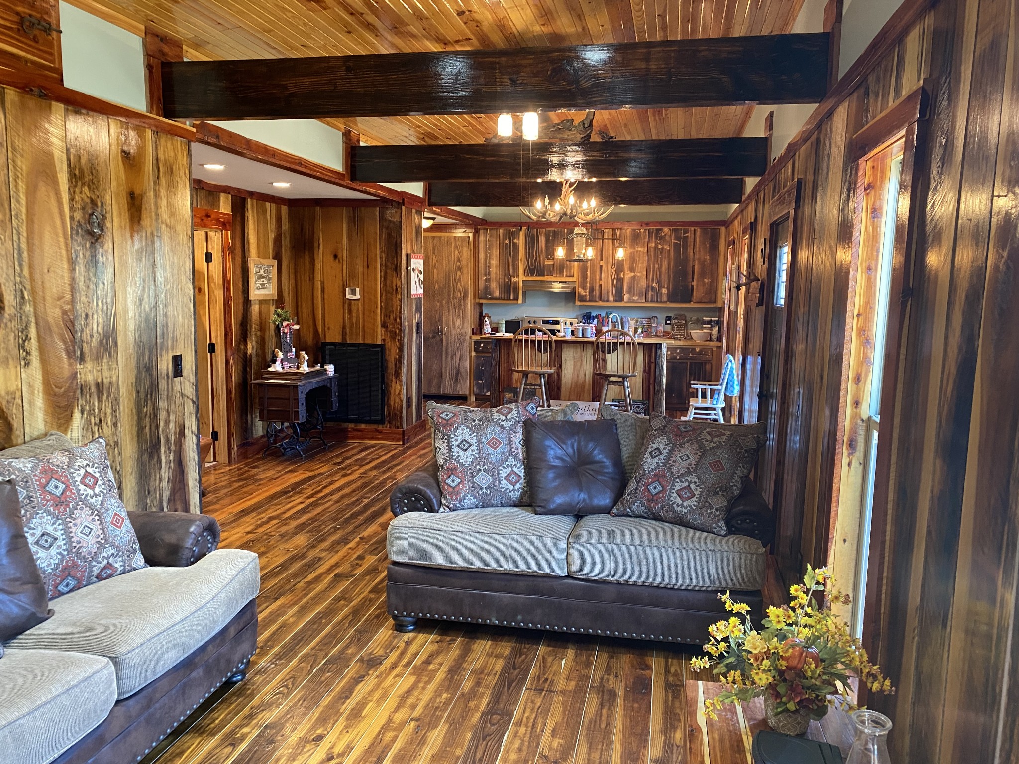1063 Swan Mill Road Morrison, TN 37357 - Photo 13 of 35 a living room with furniture and a chandelier
