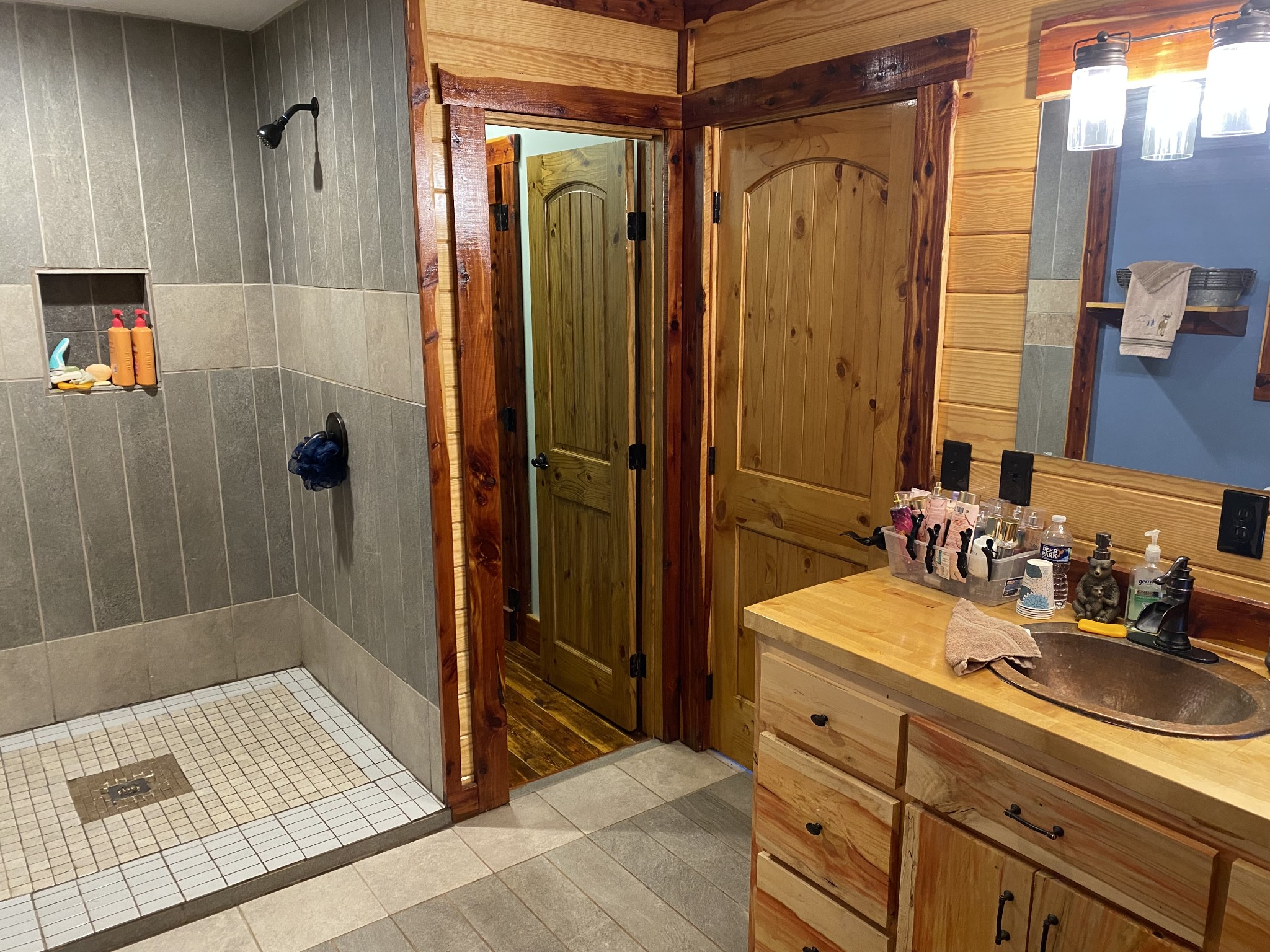 1063 Swan Mill Road Morrison, TN 37357 - Photo 24 of 35 a bathroom with a shower sink and mirror