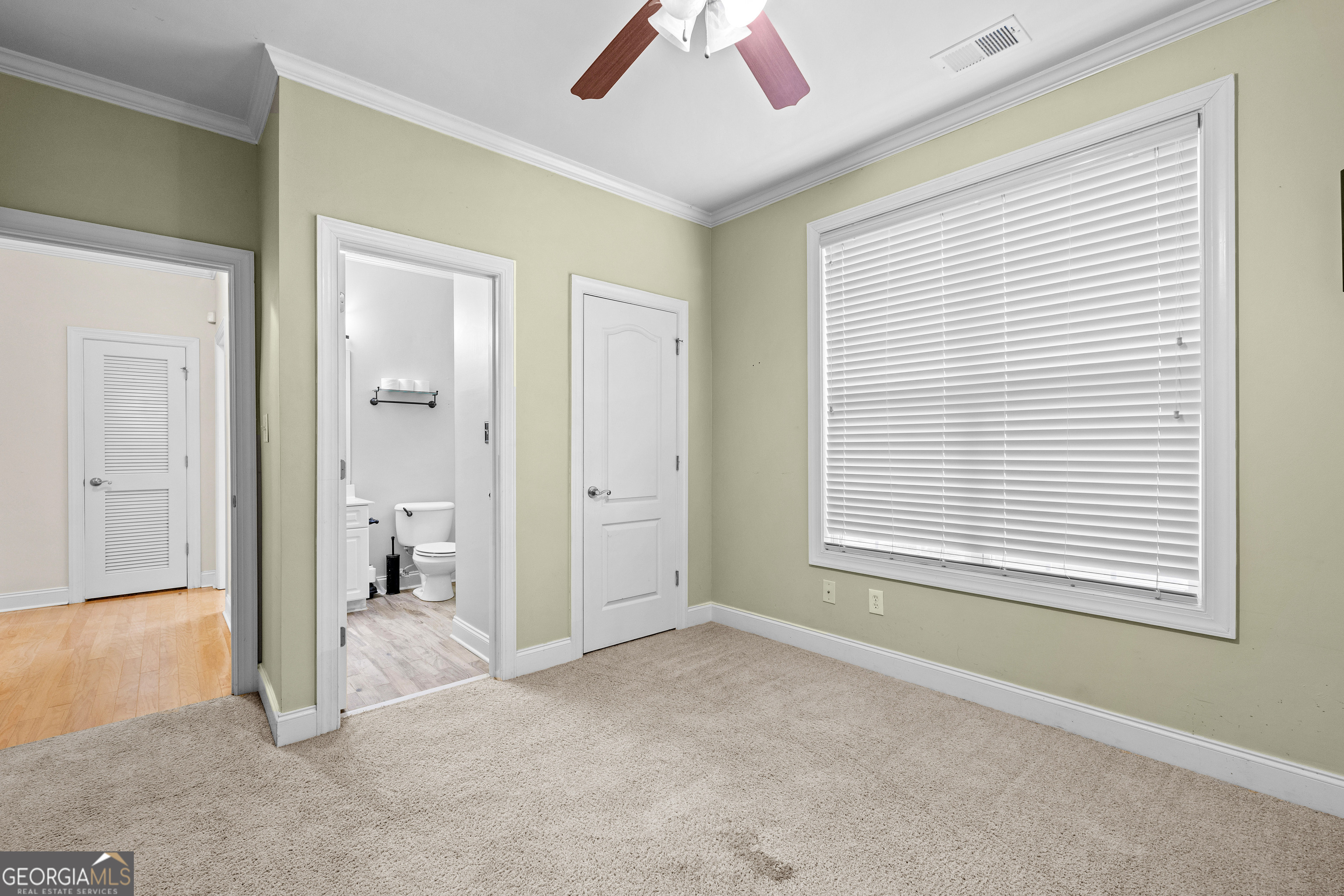 120 Shankhill Ridge Tyrone, GA 30290 - Photo 32 of 54 a view of livingroom with a ceiling fan and window