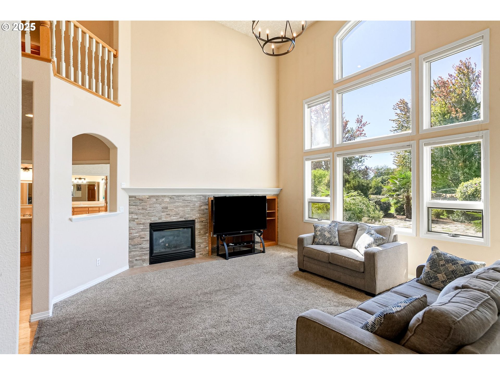 2815 Hazelnut Drive Woodburn, OR 97071 - Photo 12 of 22 a living room with furniture large window and a fireplace