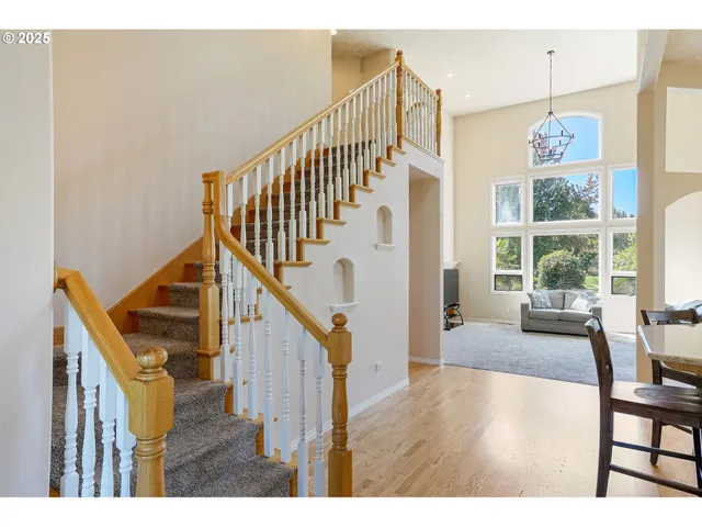 a kitchen with stainless steel appliances kitchen island granite countertop a refrigerator and stove