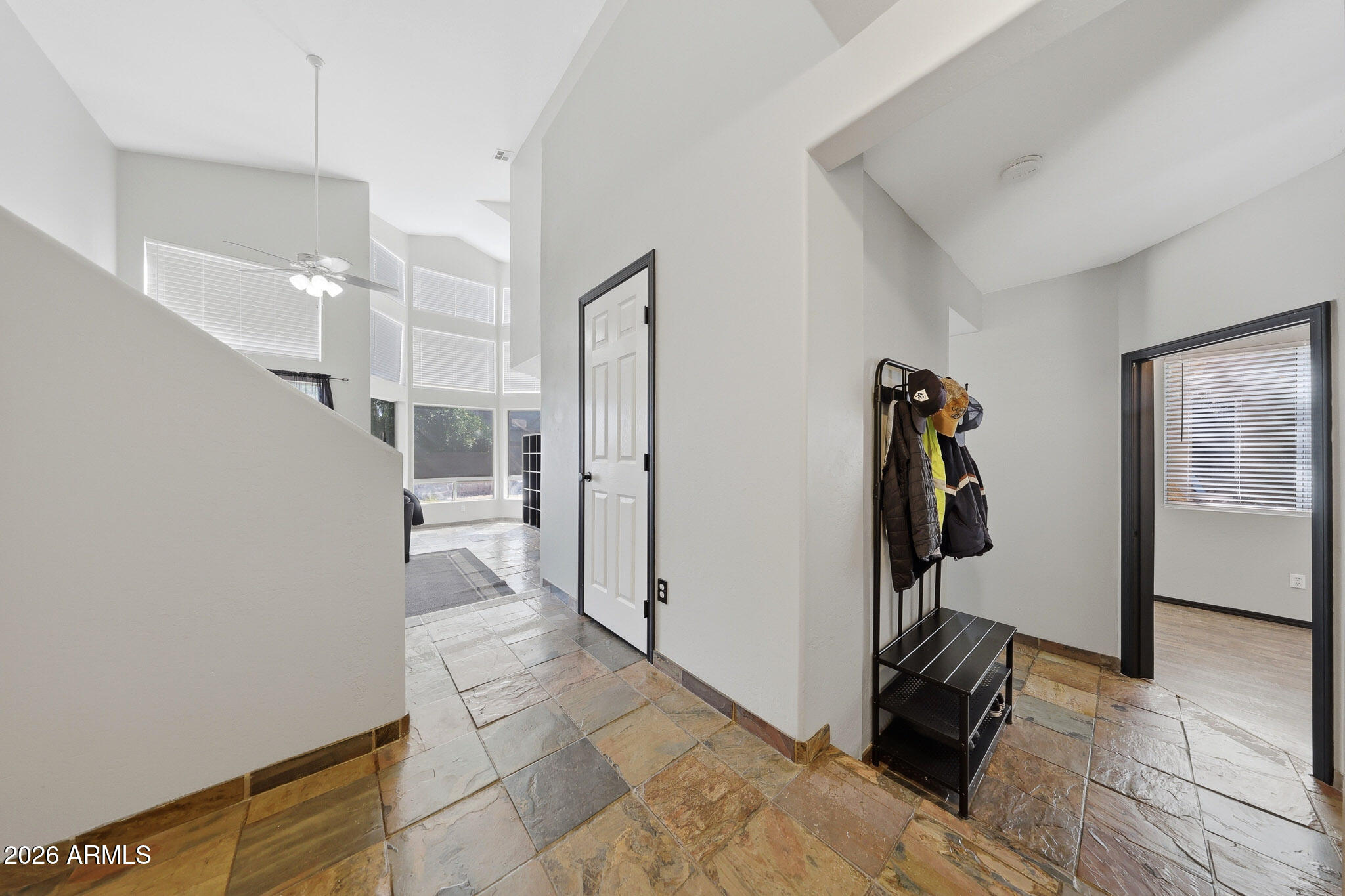2167 East Nighthawk Way Phoenix, AZ 85048 - Photo 8 of 28 a view of a hallway with closet and a rug