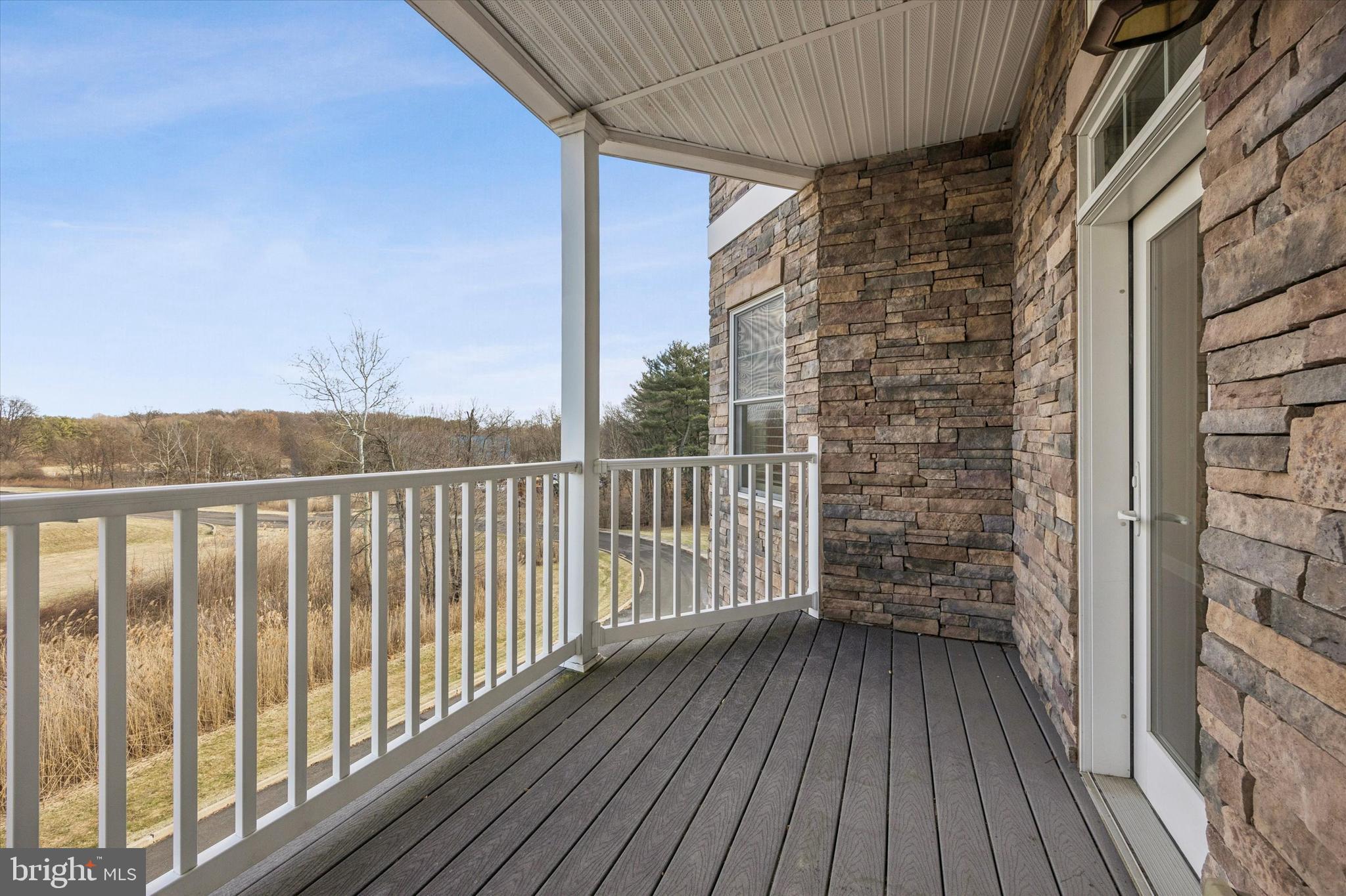 300 Tyler Court, Unit 431 Philadelphia, PA 19111 - Photo 19 of 29 a view of a balcony with wooden floor and fence