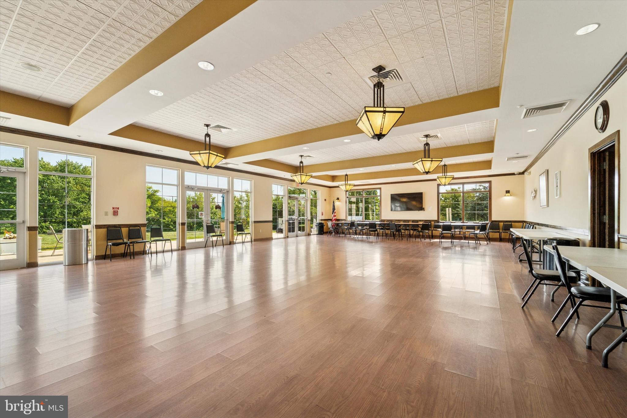 300 Tyler Court, Unit 431 Philadelphia, PA 19111 - Photo 27 of 29 a view of a hall with an empty room and wooden floor
