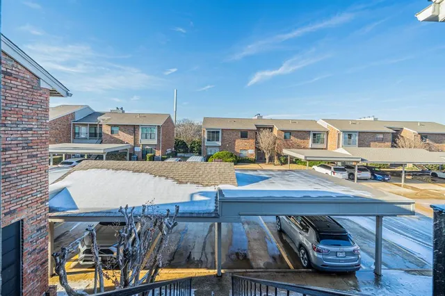 a view of a swimming pool with sitting area