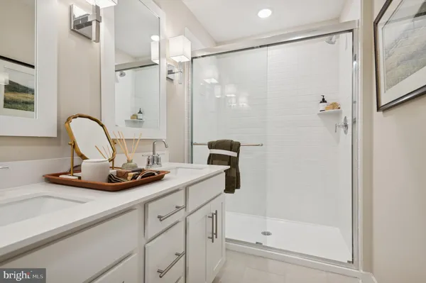 a view of a bathroom with a shower and a sink