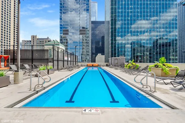 a view of city from balcony with outdoor seating