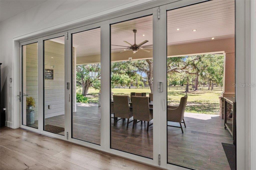 12615 River Road Myakka City, FL 34251 - Photo 11 of 88 a view of a room with wooden floor and windows