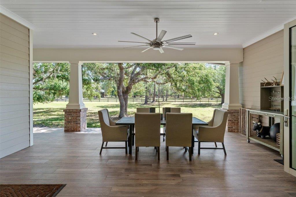 12615 River Road Myakka City, FL 34251 - Photo 13 of 88 a dining room with furniture window and wooden floor