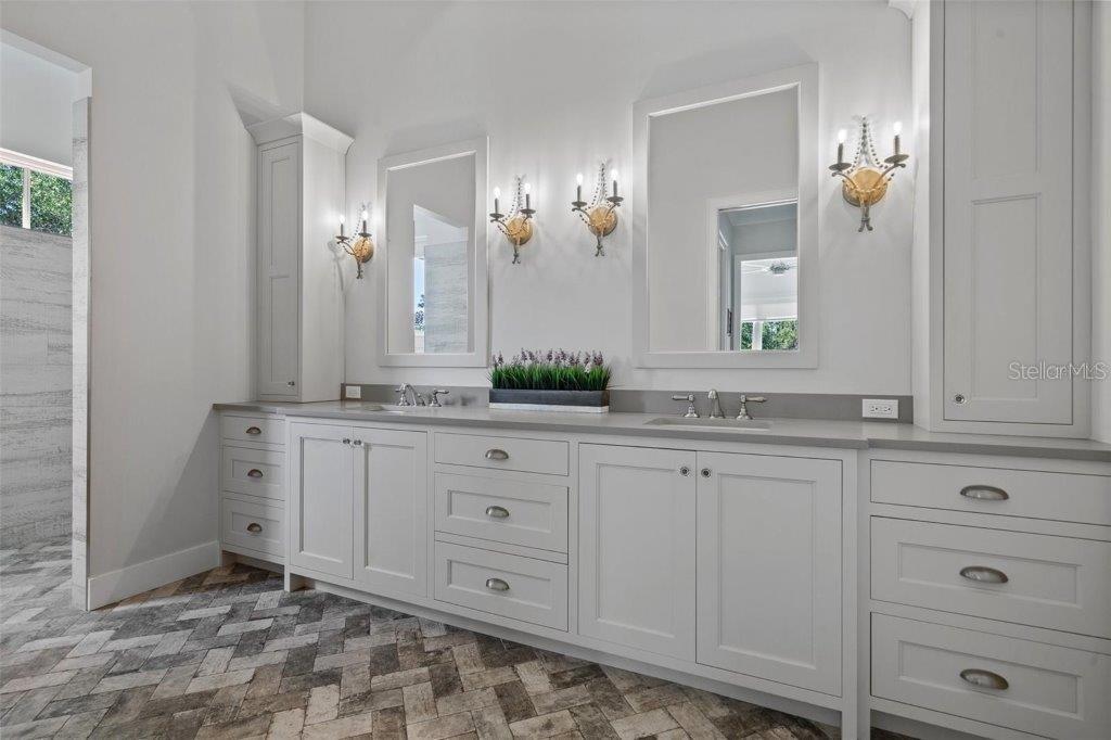 12615 River Road Myakka City, FL 34251 - Photo 26 of 88 a bathroom with a sink and mirror