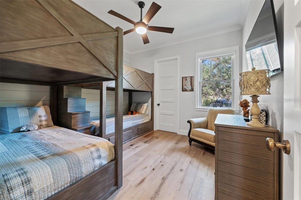 12615 River Road Myakka City, FL 34251 - Photo 35 of 88 a bedroom with a bed and wooden floor