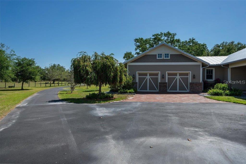 12615 River Road Myakka City, FL 34251 - Photo 53 of 88 a front view of a house with a yard and garage