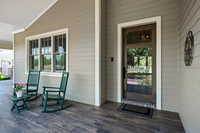 a swimming pool with some trees in the background