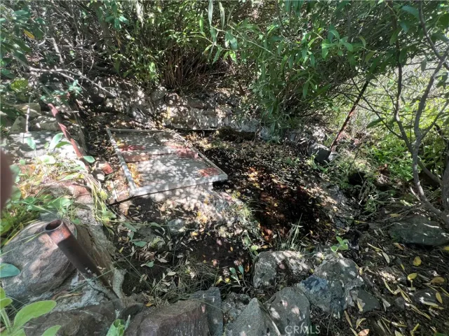a bathroom with a sink a mirror and shower