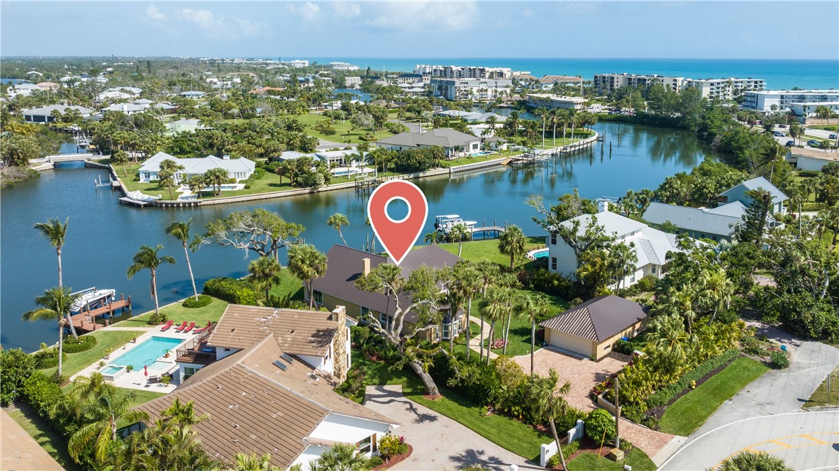 635 Live Oak Road Vero Beach, FL 32963 - Photo 1 of 35 an aerial view of residential houses with outdoor space and lake view