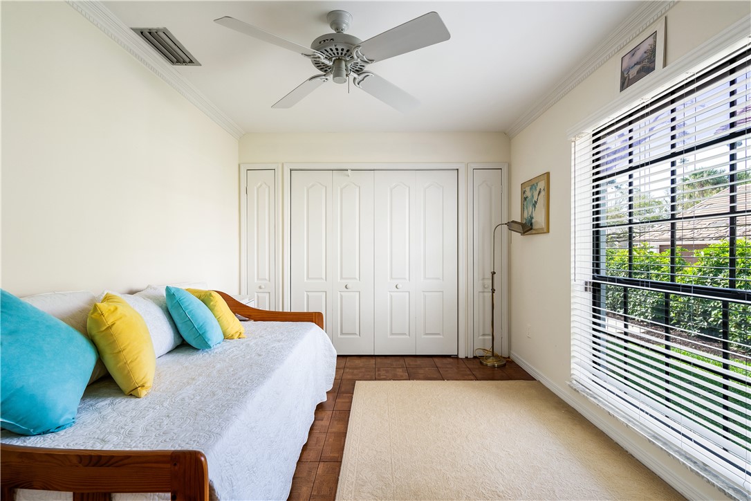 635 Live Oak Road Vero Beach, FL 32963 - Photo 19 of 35 a bedroom with a bed and a window