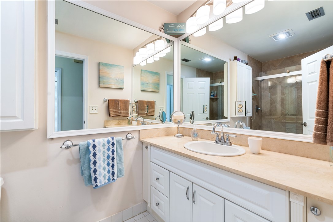 635 Live Oak Road Vero Beach, FL 32963 - Photo 20 of 35 a bathroom with a sink mirror and