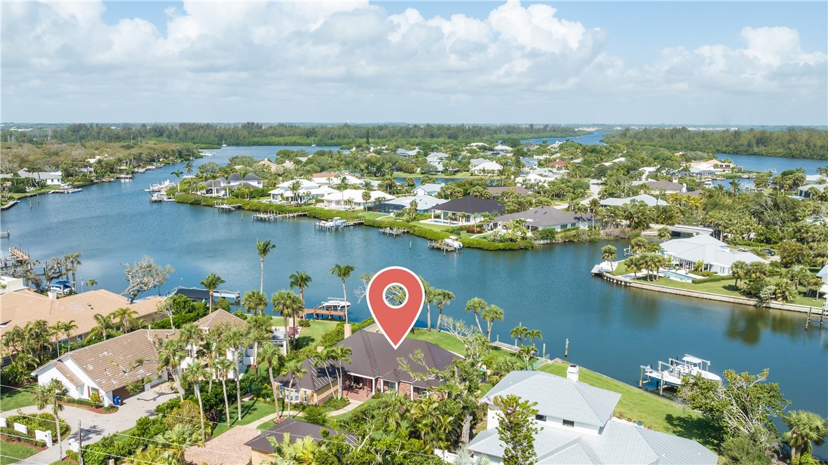 635 Live Oak Road Vero Beach, FL 32963 - Photo 2 of 35 an aerial view of residential houses with outdoor space and lake view in back