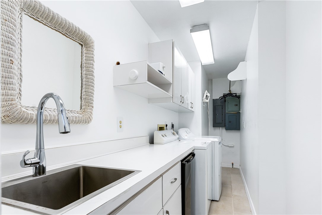 635 Live Oak Road Vero Beach, FL 32963 - Photo 23 of 35 a kitchen with a sink and a stove top oven