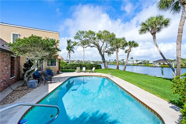 a view of a lake with houses in the back