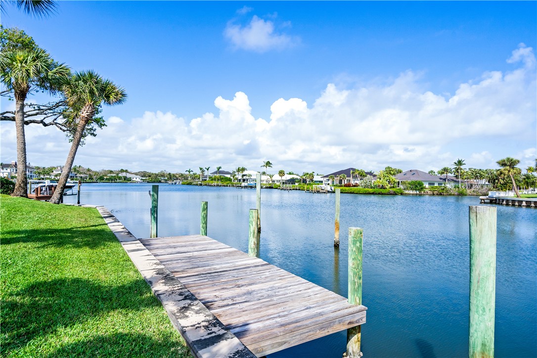 635 Live Oak Road Vero Beach, FL 32963 - Photo 31 of 35 a view of a lake with houses in the back