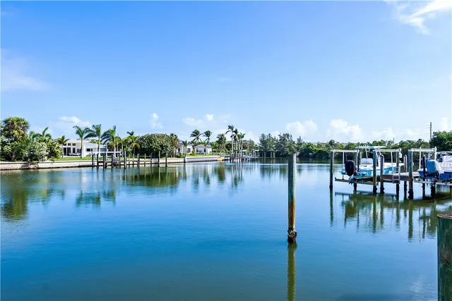 a view of a lake with houses in the back
