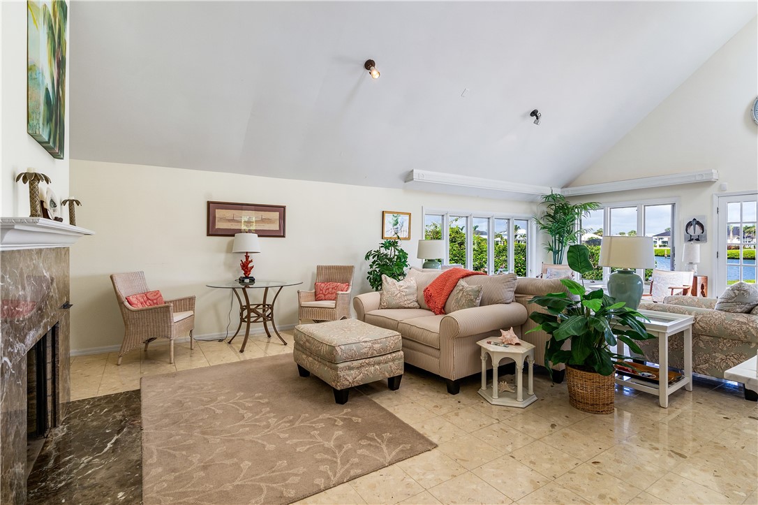 635 Live Oak Road Vero Beach, FL 32963 - Photo 5 of 35 a living room with furniture and a fireplace