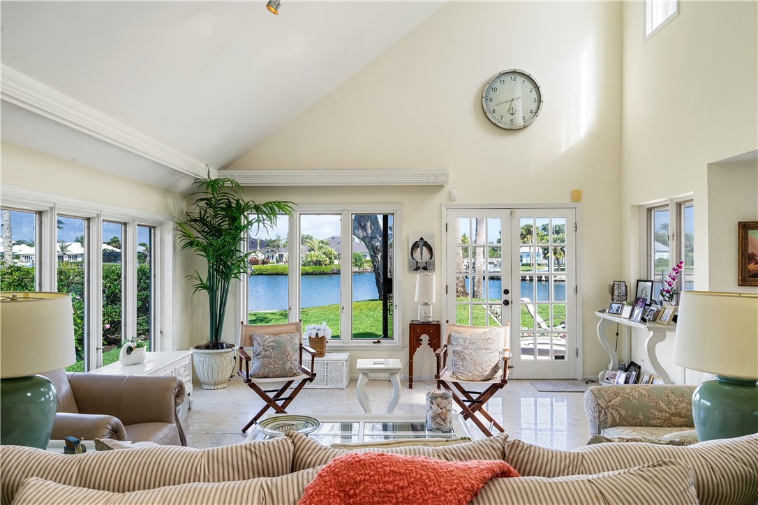 635 Live Oak Road Vero Beach, FL 32963 - Photo 7 of 35 a living room with fireplace furniture and a large window