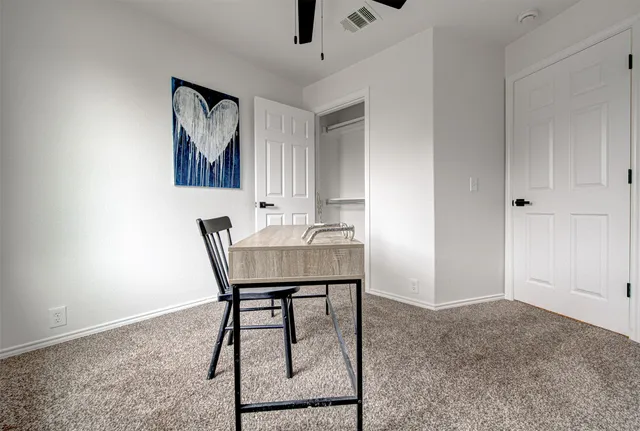 a workspace with furniture and window