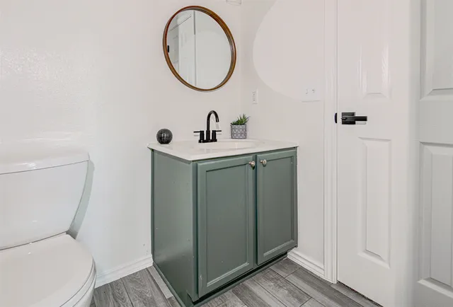 a bathroom with a toilet and a sink