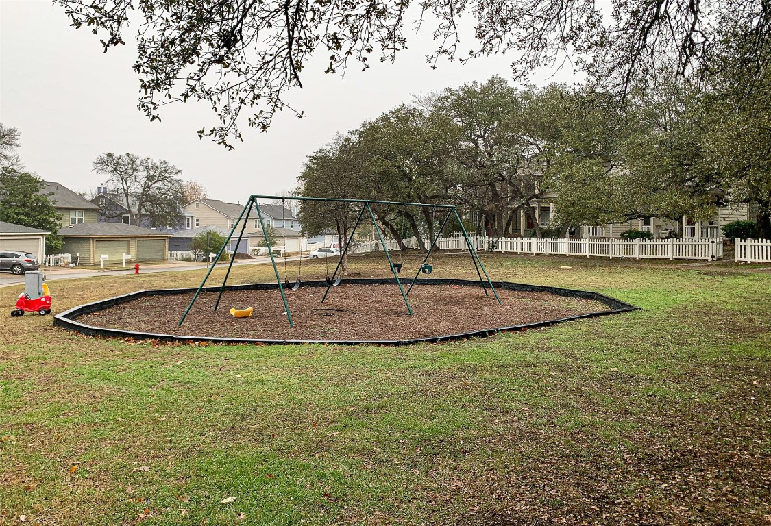 6249 Negley, Unit B Kyle, TX 78640 - Photo 26 of 26 Community playground with a residential view