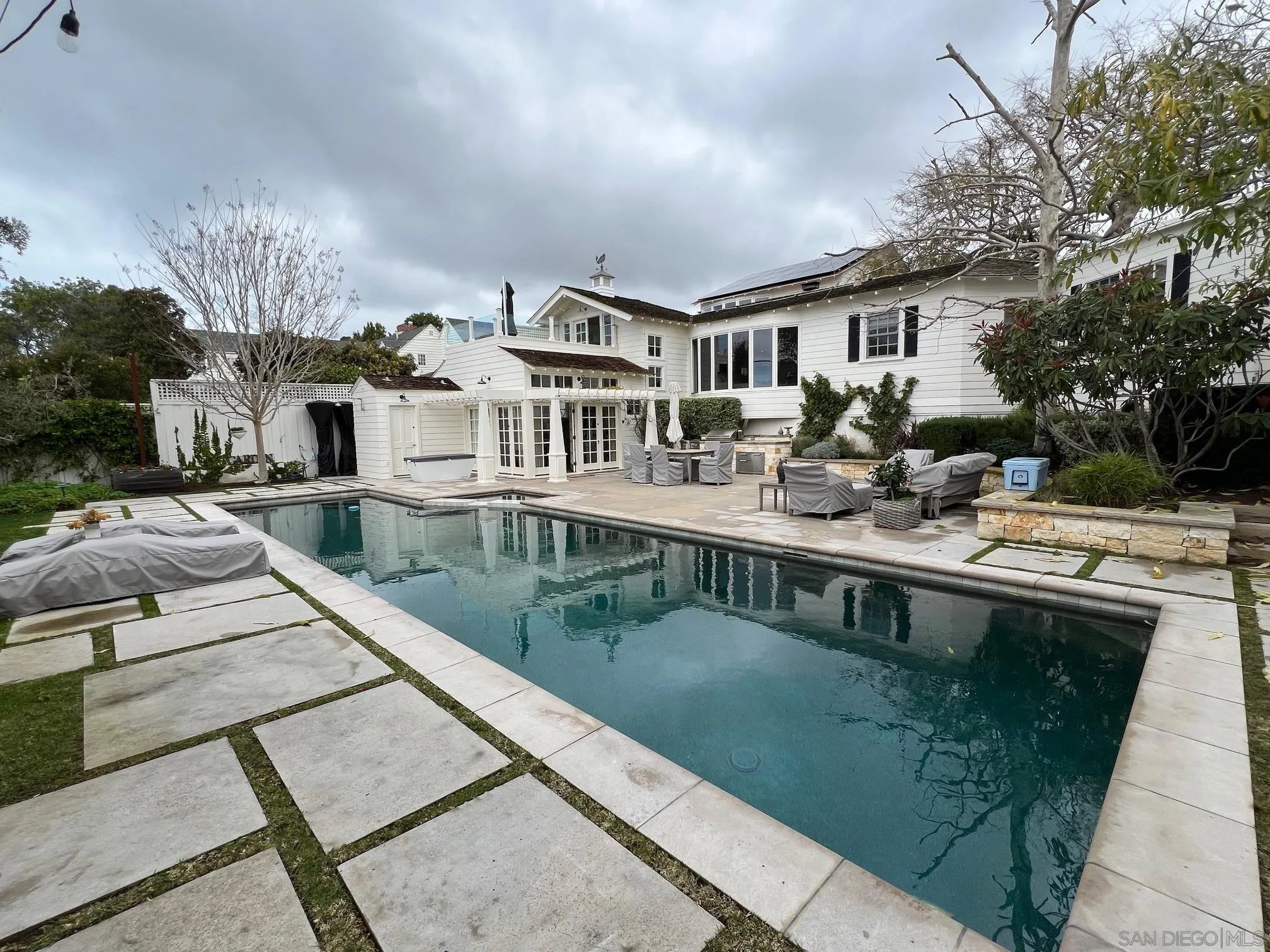 5844 Beaumont Avenue La Jolla, CA 92037 - Photo 3 of 26 a view of a house with pool and sitting area