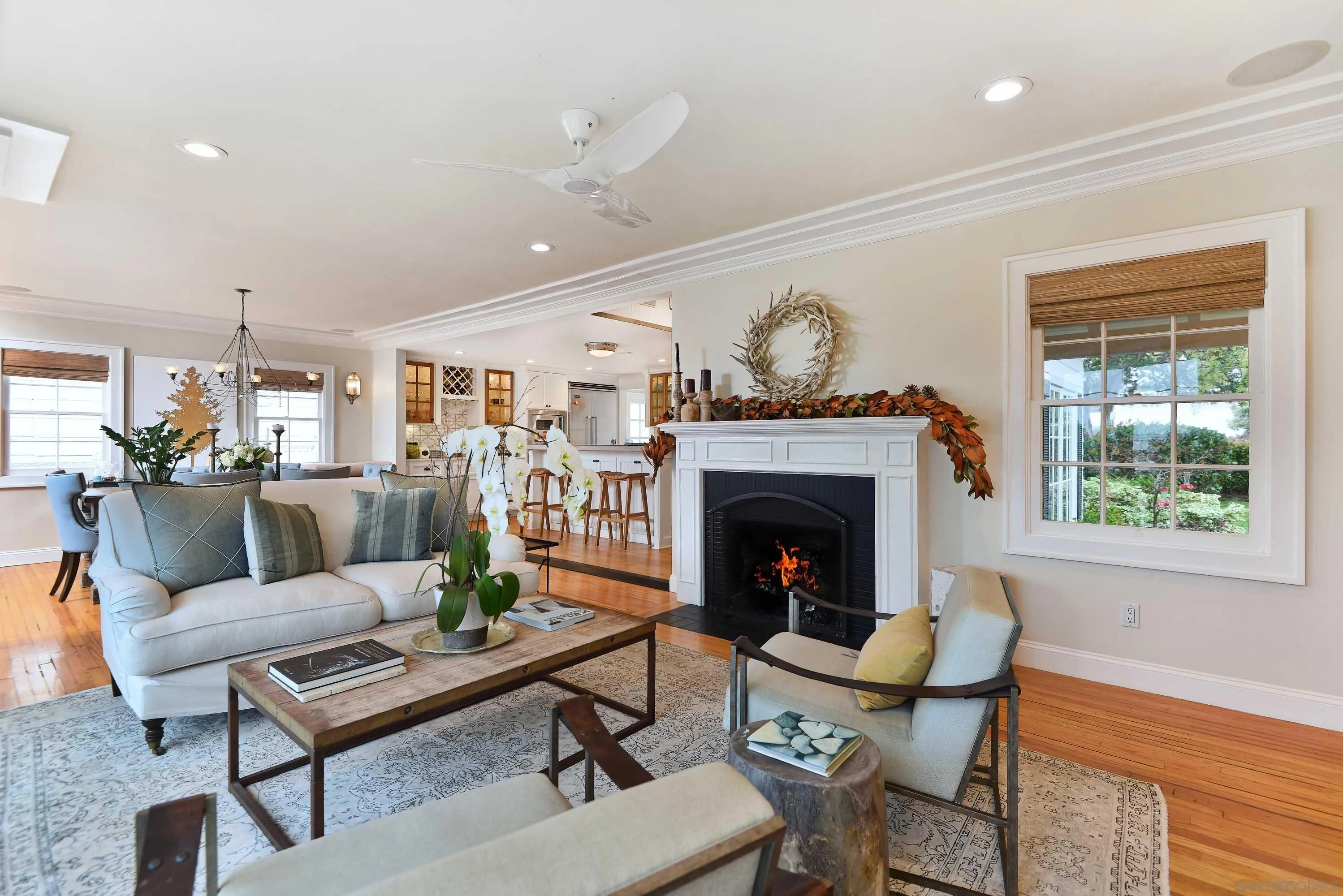 5844 Beaumont Avenue La Jolla, CA 92037 - Photo 4 of 26 a living room with furniture and a fireplace