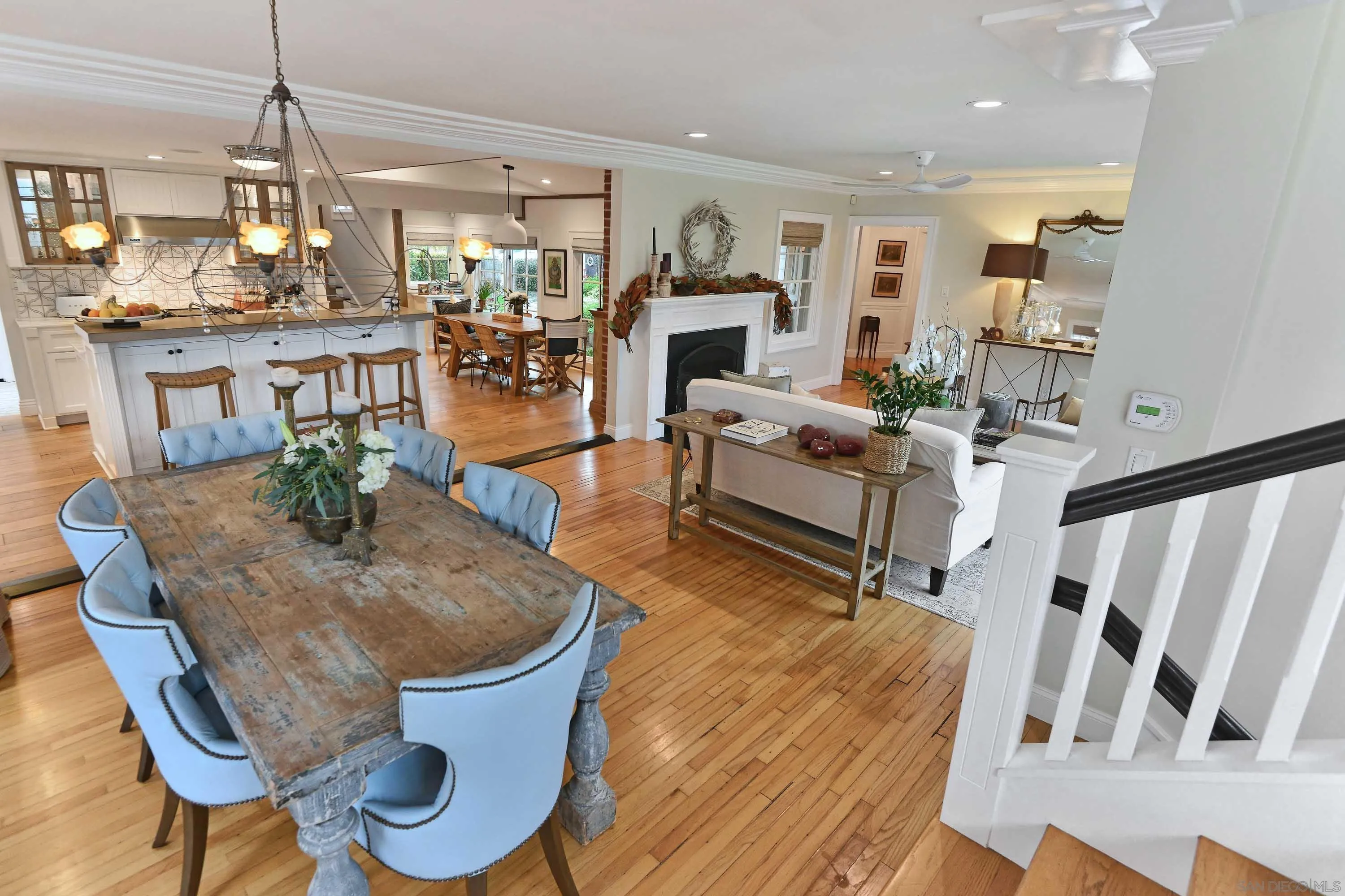 5844 Beaumont Avenue La Jolla, CA 92037 - Photo 7 of 26 a living room with furniture and a fireplace