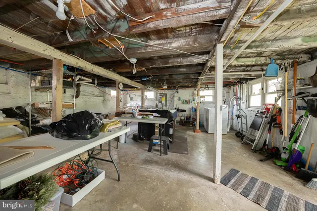 a bathroom with a sink toilet and shower curtain