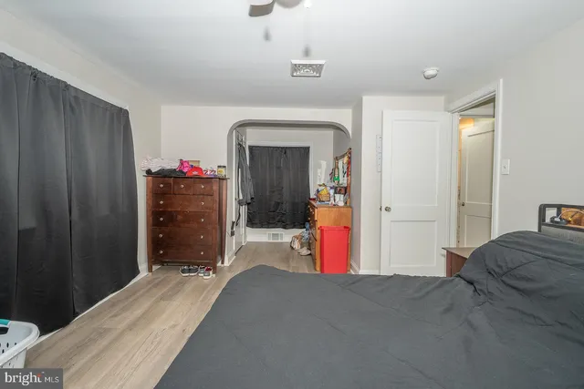 a view of deck with furniture and barbeque oven in the backyard