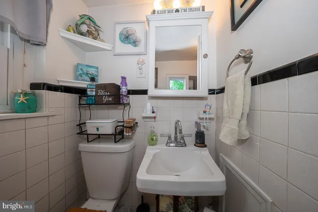 a view of a house with a yard and tree s